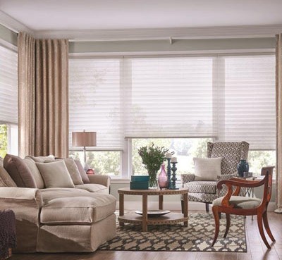 bright modern living room with brown furniture blinds and shades
